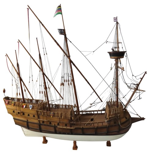 70 - A WOODEN MODEL OF A SPANISH 16TH CENTURY GALLEON, with four fully rigged masts and twenty two guns, ... 