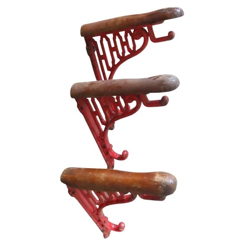 48 - A GROUP OF THREE VINTAGE WALL MOUNTED SADDLE RACKS, EARLY 20TH CENTURY, with  red painted pierced ca... 