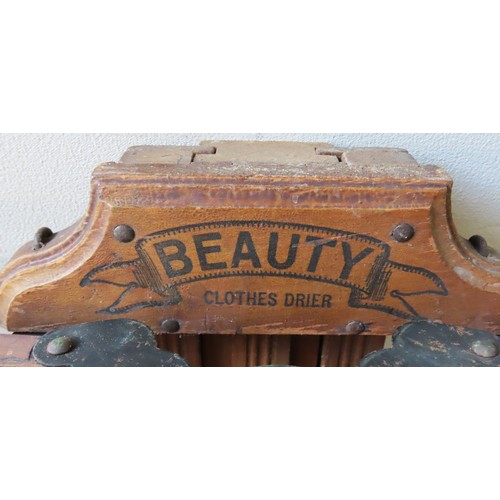 13 - A VINTAGE 'BEAUTY' WALL MOUNTED CLOTHES AIRER AND TWO BOOT JACKS, EARLY 20TH CENTURYProvenance: Sele... 