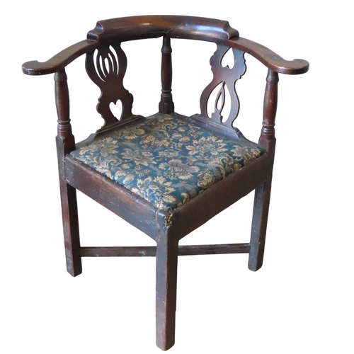 94 - A OAK 19TH CENTURY CORNER CHAIR, the scrolling right angled top rail raised on irregular lyre form s... 