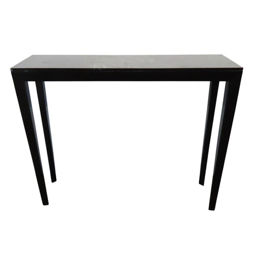 619 - AN OKA BLACK LACQUERED CONSOLE TABLE, LATE 20TH CENTURY, the rectangular top raised on elegant taper... 