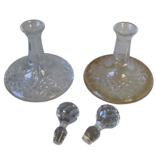 62 - TWO CUT GLASS SHIP'S DECANTERS LATE 19TH CENTURY both with faceted globular stoppers 25.5 cm high ma... 