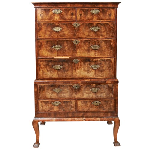 136 - A GEORGE I WALNUT AND FEATHER BANDED CHEST ON STAND, circa 1725, the the carved and moulded cornice ... 