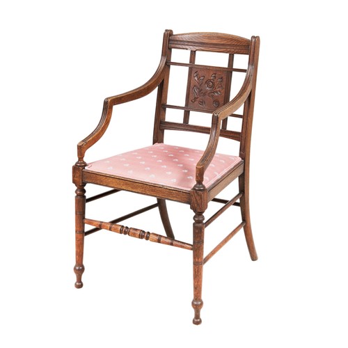 95 - AN OAK ARTS & CRAFTS OPEN ARMCHAIR, circa 1900, raised on turned legs united by conforming stret... 