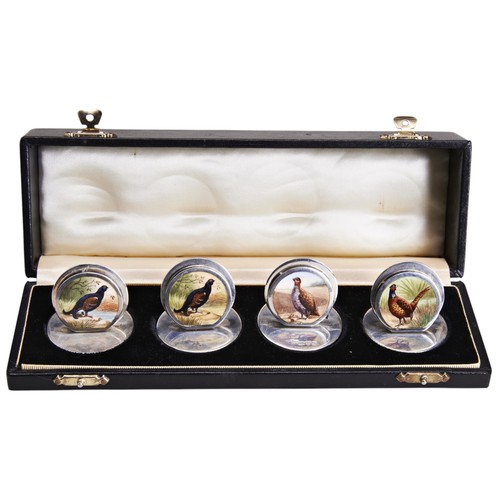 132 - A SET OF FOUR SAMPSON MORDAN & CO GAME BIRD SILVER MENU HOLDERS, with circular enamelled plaques... 