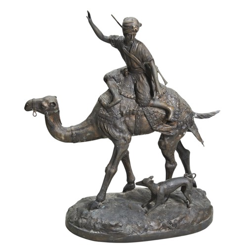 82 - A LARGE COPPER ALLOY SCULPTURE OF AN INDIAN CAMEL SOLDIER with a dog by the camel's feet. 20th centu... 