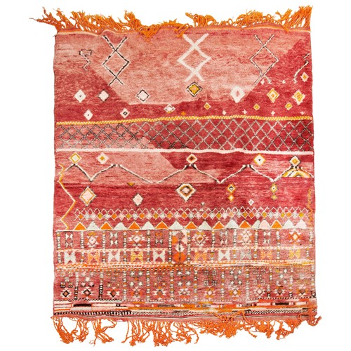 142 - WOOLLEN RUG Red ground, unusual varied pattern, orange fringing 215cm x 148cm PROVENANCE: From The H... 