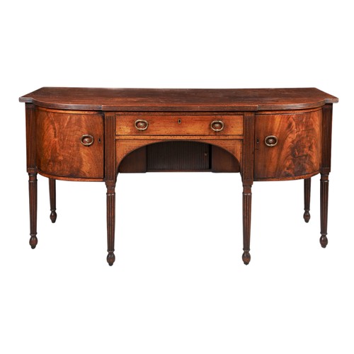 112 - A GEORGE III MAHOGANY BOW FRONT SIDEBOARD, circa 1800, in the manner of Gillows, the shaped top on a... 