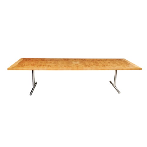 92 - A LONG MODERNIST DINING TABLE WITH BURR WOOD TOP AND T-SHAPED CHROME SUPPORTS 300 x 100 x 71 cms PRO... 