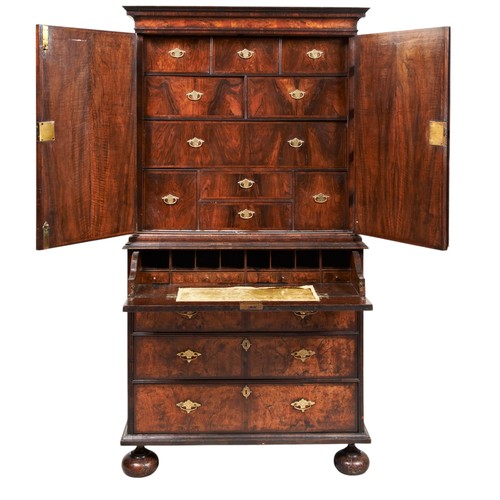 143 - A FINE WILLIAM AND MARY WALNUT AND FEATHER BANDED SECRETAIRE CABINET ON STAND CIRCA 1700 the moulded... 