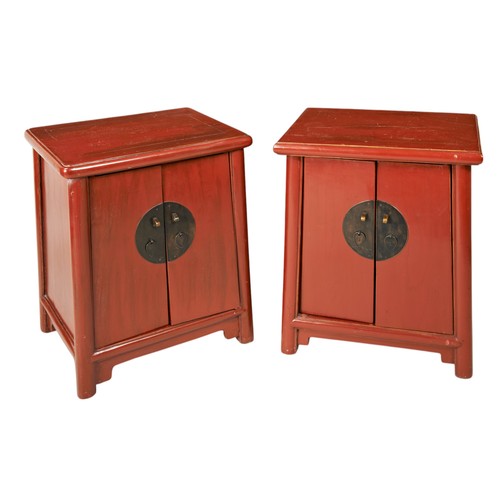 70 - A PAIR OF CHINESE RED LACQUER SIDE CABINETS, 20th century, of square tapered form each with two cupb... 