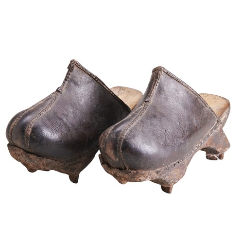 78 - A PAIR OF CHINESE LEATHER RICE PADDY SHOES with wooden platforms and metal tab 'grips', possibly ear... 