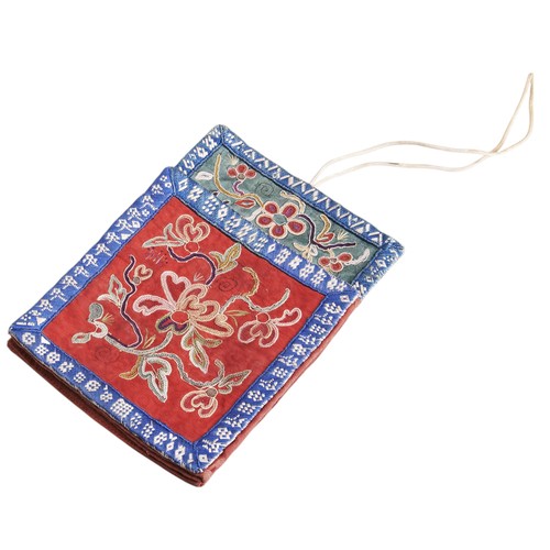 84 - AN ANTIQUE CHINESE EMBROIDERED PURSE, the front with floral chain stitch decoration and woven border... 