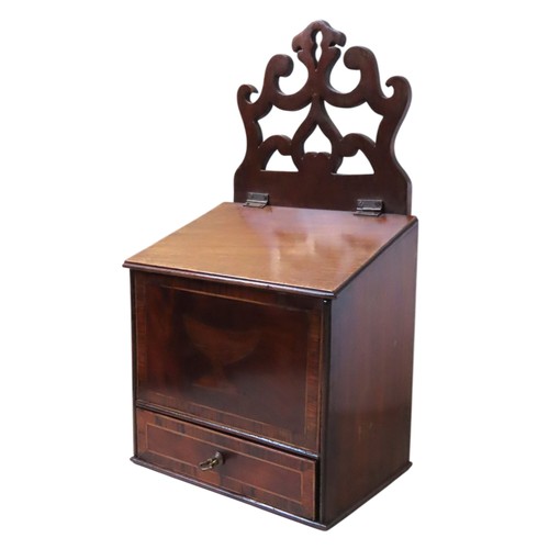 438 - A REGENCY MAHOGANY AND CROSS BANDED CANDLE BOXCIRCA 1820scrolling gallery back over a sloping hinged... 