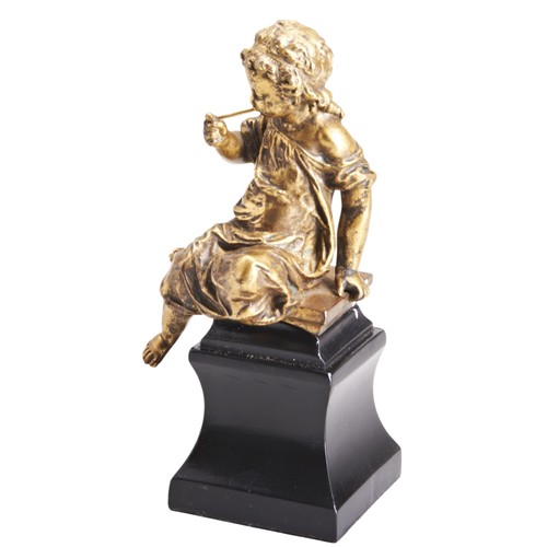 538 - AFTER MOREAU, A GILT BRONZE FIGURE OF PUTTICIRCA 1870the robed putti modelled holding a pipe, seated... 