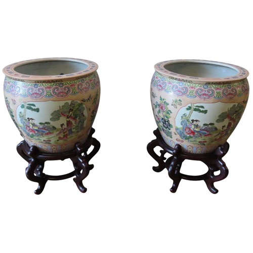 490 - LARGE PAIR OF FAMILLE ROSE 'FISH' BOWLS ON STANDS20TH CENTURYwith apocryphal Qianlong seal marks 52c... 