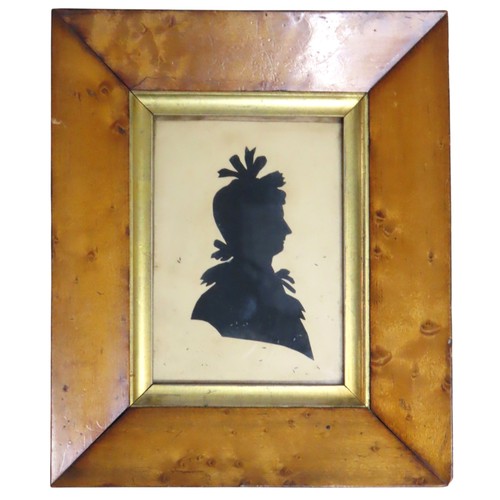 553 - A GEORGIAN SILHOUETTE OF A LADY in a walnut frame with old label verso 'Mrs Scott April 1831' and a ... 