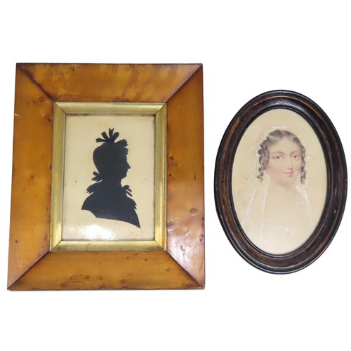 553 - A GEORGIAN SILHOUETTE OF A LADY in a walnut frame with old label verso 'Mrs Scott April 1831' and a ... 