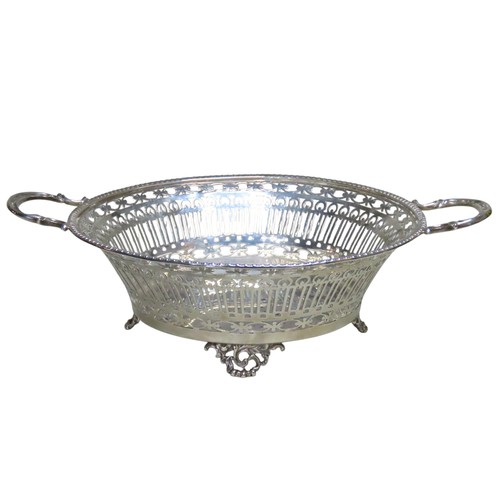 520 - A LATE VICTORIAN SILVER BREAD BASKETSHEFFIELD 1896circular tapering form, with twin scroll handles a... 