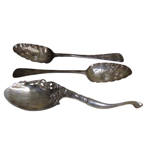 519 - A PAIR OF GEORGIAN SILVER BERRY SPOONSCIRCA 1780with bright cut handles and repousse bowls, indistin... 