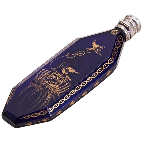 465 - A GEORGE III BRISTOL BLUE GLASS SCENT BOTTLECIRCA 1780elongated octagonal form with gilt decorated s... 