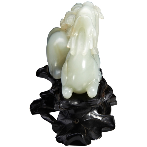 36 - A FINE CARVED PALE-GREEN JADE GROUP OF TWO STAGS QIANLONG PERIOD (1736-1795)青白玉鹿衔玉兰摆件 乾隆 1736-1795mo... 