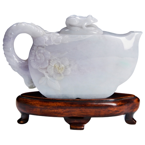 101 - A LAVENDER JADEITE WATER DROPPER 20TH CENTURY淡紫玉壶 二十世纪the scroll handle carved with peonies and the ... 