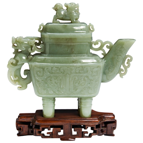 102 - AN ARCHAISTIC CELADON JADE RITUAL WINE VESSEL AND COVER20TH CENTURY青白玉仿古玉壶 二十世纪with a carved dragon ... 