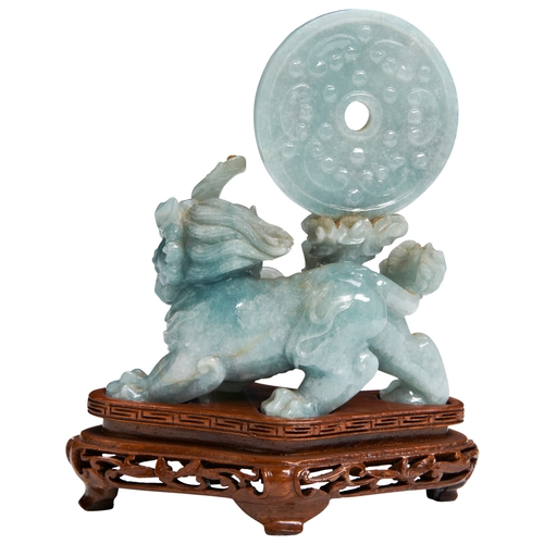 103 - A JADEITE 'QILIN' GROUP20TH CENTURY翡翠麒麟摆件 二十世纪 well carved as the rampant Qilin holding a lotus stem... 