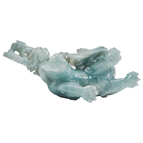 103 - A JADEITE 'QILIN' GROUP20TH CENTURY翡翠麒麟摆件 二十世纪 well carved as the rampant Qilin holding a lotus stem... 