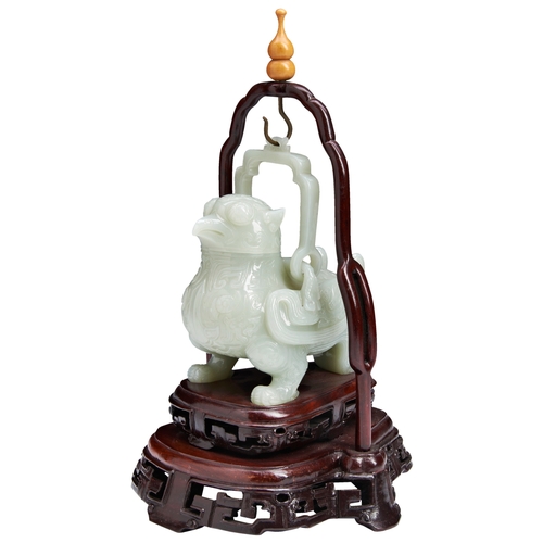 104 - A GOOD PALE-CELADON JADE 'MYTHICAL BEAST' CENSER AND COVER 20TH CENTURY白玉瑞兽摆件 十二世纪with a wood stand ... 