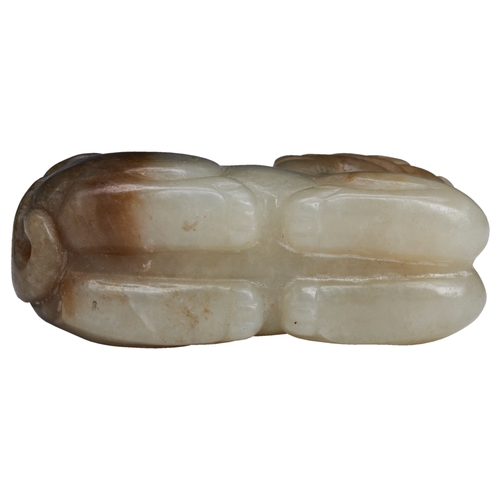 107 - A SMALL JADE CARVING OF A RECUMBENT BUDDHIST LION MING / QING DYNASTY, 17TH CENTURY青白玉狮 十七世纪with two... 