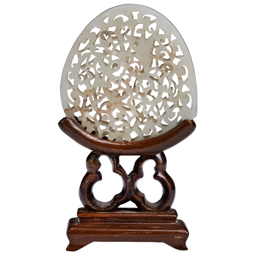 108 - A WHITE JADE PEACH-SHAPED OPENWORK PIERCED BELT PLAQUEWANLI PERIOD (1573-1619)白玉镂雕摆件 万历 1573-1619int... 