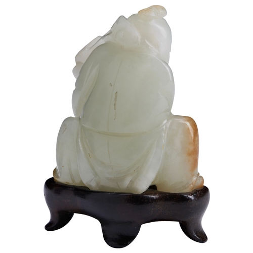 110 - A PALE CELADON AND RUSSET JADE CARVING OF A KNEELING BOYQIANLONG PERIOD (1736-1795)青白玉童子像 乾隆 1736-17... 