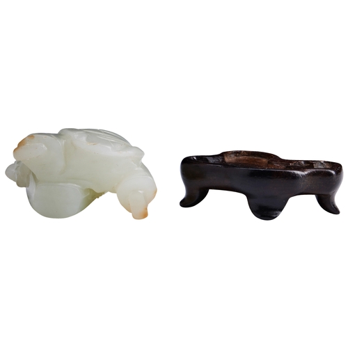 110 - A PALE CELADON AND RUSSET JADE CARVING OF A KNEELING BOYQIANLONG PERIOD (1736-1795)青白玉童子像 乾隆 1736-17... 