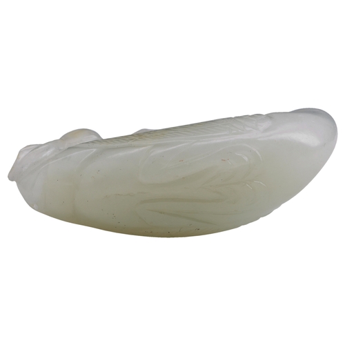 114 - A PALE CELADON JADE CARVING OF A CRANEQIANLONG PERIOD (1736-1795)青白玉鹤衔灵芝with its head turned back ho... 