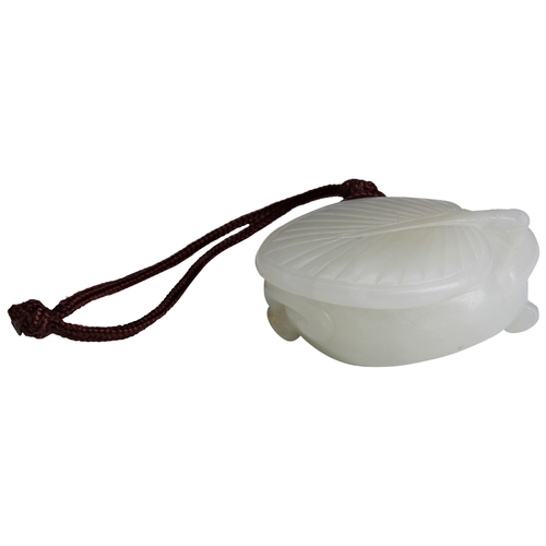 116 - A PALE CELADON JADE CARVING OF A RECUMBENT CAT WITH INSECTQIANLONG PERIOD (1736-1795)白玉猫 乾隆 1736-179... 