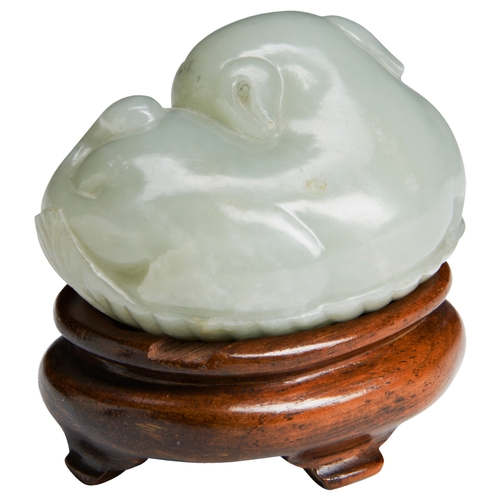 120 - A FINE PALE-CELADON JADE CATQING DYNASTY, 18TH / 19TH CENTURY青白玉猫 清十八/十九世纪modelled recumbent resting... 