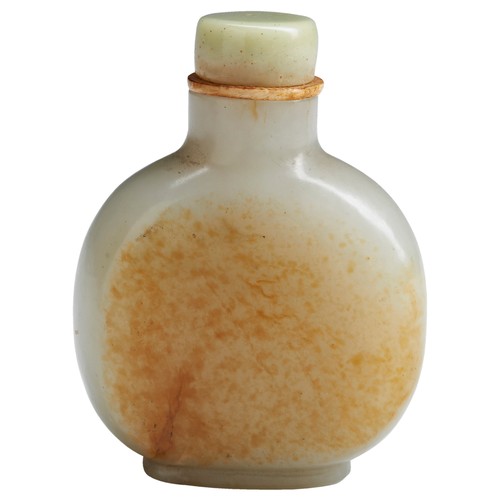 118 - A FINE CARVED PALE-CELADON AND RUSSET JADE SNUFF BOTTLEPOSSIBLY MASTER OF THE ROCKS SCHOOL, QING DYN... 