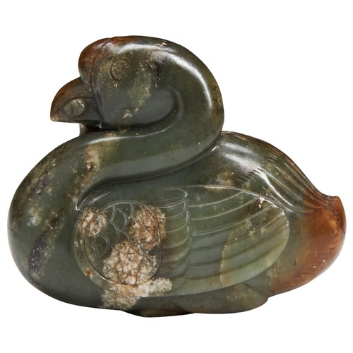 136 - A CELADON AND RUSSET JADE MANDARIN DUCKLATE MING DYNASTY褐玉鸳鸯衔荷花  晚明modelled as the duck facing forwa... 