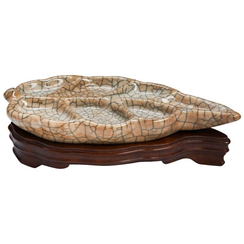 161 - A 'GUAN' LEAF-SHAPED BRUSH WASHERYUAN/MING DYNASTY ‘官’ 窑笔洗 元/明  the pale greyish-brown glaze covered... 