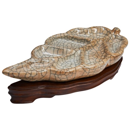 161 - A 'GUAN' LEAF-SHAPED BRUSH WASHERYUAN/MING DYNASTY ‘官’ 窑笔洗 元/明  the pale greyish-brown glaze covered... 