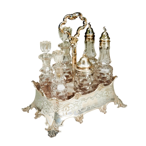 92 - A VICTORIAN SILVER CRUET STAND, LONDON 1865A six bottle cruet stand with engraved decoration on four... 