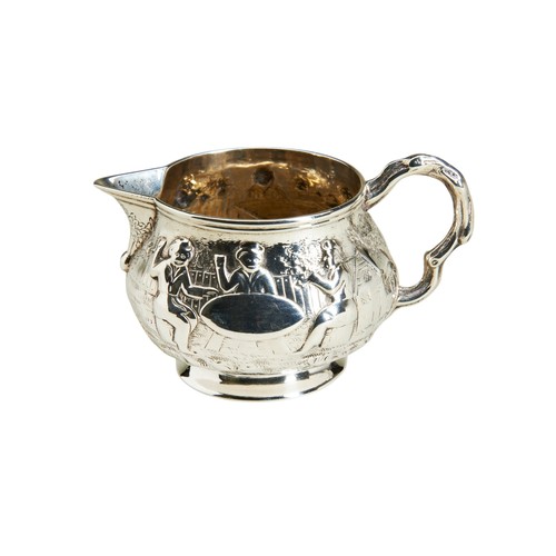 115 - A SQUAT CIRCULAR CREAM JUG, LONDON 1867A small cream jug chased with tavern scenes with a handle cas... 