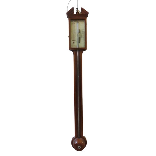 A GEORGE III MAHOGANY STICK BAROMETER, with break arch pediment and ...