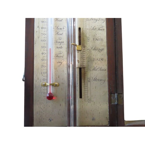 A GEORGE III MAHOGANY STICK BAROMETER, with break arch pediment and ...