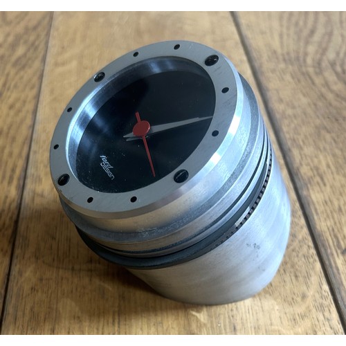 130 - A FORD DESIGN PISTON DESK CLOCKAn original piston adapted to accommodate a digital clock. 90mm in di... 