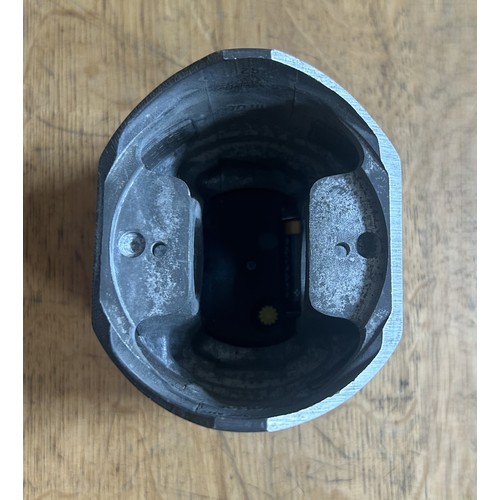 130 - A FORD DESIGN PISTON DESK CLOCKAn original piston adapted to accommodate a digital clock. 90mm in di... 