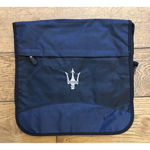 122 - A COLLECTION OF MASERATI BRANDED MERCHANDISEA waterproof winter jacket by Reverse Clothing, with rem... 