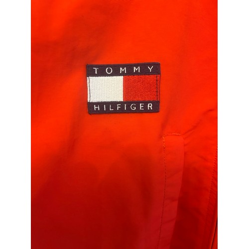 108 - THREE BRANDED FERRARI JACKETSA 1990s Tommy Hilfiger Ferrari jacket in red polyester, windbreaker sty... 